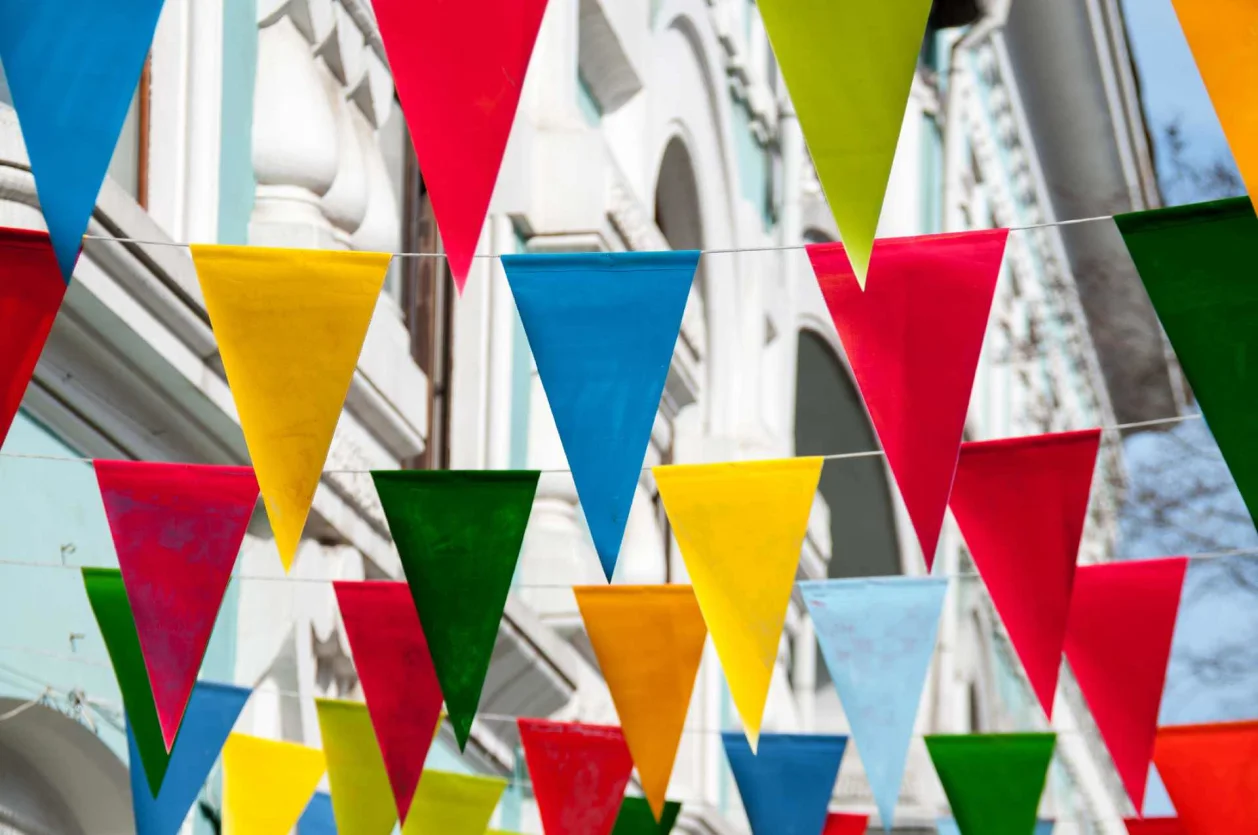 colorful flags across buildings